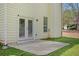 Back patio off the house with french doors, overlooking a well-maintained and landscaped yard at 4535 Howell Farms Nw Rd, Acworth, GA 30101