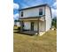 A covered porch offers outdoor living space in the backyard of this two-story home at 4839 Station Lane -Lot 31, Union City, GA 30349