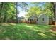Spacious backyard with a wooden deck and green lawn, perfect for outdoor activities at 1321 Avon Sw Ave, Atlanta, GA 30310