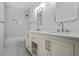 Bathroom features a double sink vanity, shower/bathtub combo, and modern finishes at 1321 Avon Sw Ave, Atlanta, GA 30310