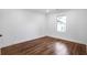 Clean bedroom featuring hardwood floors, and a single window view at 1321 Avon Sw Ave, Atlanta, GA 30310