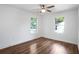 Bright bedroom with hardwood floors, ceiling fan and views from two windows at 1321 Avon Sw Ave, Atlanta, GA 30310