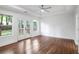 Spacious bedroom with a ceiling fan and a view of the deck through French doors at 1321 Avon Sw Ave, Atlanta, GA 30310