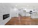 Bright open concept living space featuring hardwood floors, and a stone fireplace at 1321 Avon Sw Ave, Atlanta, GA 30310