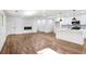 Spacious living room featuring a modern fireplace and a kitchen with an island at 1321 Avon Sw Ave, Atlanta, GA 30310