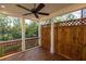 Relaxing back porch with wood decking, a ceiling fan, and privacy lattice, perfect for outdoor enjoyment at 2260 Siskin Square Rd # 90, Duluth, GA 30096