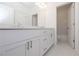 Bathroom featuring double sinks, white cabinets, and modern fixtures at 2260 Siskin Square Rd # 90, Duluth, GA 30096