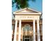 The City Hall facade features columns, an arched window, and a pediment above the entrance at 2260 Siskin Square Rd # 90, Duluth, GA 30096