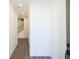 View of the home's hallway, with hardwood floors and access to the upper level staircase at 2260 Siskin Square Rd # 90, Duluth, GA 30096