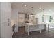 Bright modern kitchen with stainless steel appliances, large island and classic white cabinets at 2260 Siskin Square Rd # 90, Duluth, GA 30096