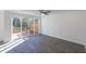 Bright open-concept living room with sliding doors to a wooden patio at 2260 Siskin Square Rd # 90, Duluth, GA 30096