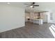 Bright open-concept living room and kitchen area with hardwood floors and sleek white walls at 2260 Siskin Square Rd # 90, Duluth, GA 30096