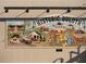 The Historic Duluth mural is a depiction of the city in colorful tiles hung on the exterior of a brick building at 2260 Siskin Square Rd # 90, Duluth, GA 30096