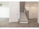 Staircase with wood treads and black metal railings, leads to the upper level, with neutral floors at 2260 Siskin Square Rd # 90, Duluth, GA 30096