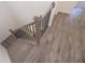 A wood staircase with gray wood treads and black metal rails leads to the upper level at 2260 Siskin Square Rd # 90, Duluth, GA 30096