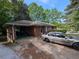 View of the side of the brick home, showing the carport and additional parking area at 2985 Laguna Dr, Decatur, GA 30032