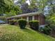 Well-kept brick home surrounded by mature landscaping, creating a warm and inviting atmosphere at 2985 Laguna Dr, Decatur, GA 30032