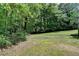 Expansive backyard that is partially wooded at 4278 Trotters Ln, Auburn, GA 30011