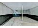 Unfinished basement features cement floor and walls with black water guard at 4278 Trotters Ln, Auburn, GA 30011