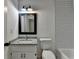 The bathroom features a granite vanity top and subway tile surround at 4278 Trotters Ln, Auburn, GA 30011