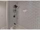 Bathroom features a shower over tub with white subway tile and bronze fixtures at 4278 Trotters Ln, Auburn, GA 30011