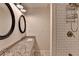 Bathroom features a double vanity, a granite countertop, decorative mirrors, and a walk-in shower at 4278 Trotters Ln, Auburn, GA 30011
