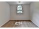 This carpeted bedroom features neutral walls and an arched window that fills the space with natural light at 4278 Trotters Ln, Auburn, GA 30011