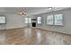 Open living space featuring neutral walls, natural light, and sleek flooring at 4278 Trotters Ln, Auburn, GA 30011
