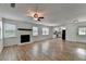 View of open living room with a fireplace and access to the kitchen area at 4278 Trotters Ln, Auburn, GA 30011