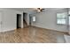 Spacious living room showcasing wood floors, a staircase, and natural light from windows at 4278 Trotters Ln, Auburn, GA 30011