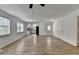 Open-concept living area showcasing a kitchen, back door, and modern flooring at 4278 Trotters Ln, Auburn, GA 30011