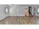 Open living space with sleek flooring, a stairway, and an entrance for easy access at 4278 Trotters Ln, Auburn, GA 30011