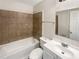 Bathroom features tile surround on the tub, a modern vanity and fixtures at 6260 Selborn Sw Dr, Atlanta, GA 30331