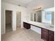 Primary bathroom offers double sinks, tile floor and separate shower and tub at 6260 Selborn Sw Dr, Atlanta, GA 30331