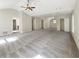 Expansive bonus room featuring neutral carpet, multiple closets, and abundant natural light at 6260 Selborn Sw Dr, Atlanta, GA 30331