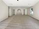 Large bonus room featuring neutral carpet and paint, two windows letting in natural light, and closet access at 6260 Selborn Sw Dr, Atlanta, GA 30331