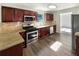 Updated kitchen featuring stainless steel appliances, granite countertops, and hardwood floors at 6260 Selborn Sw Dr, Atlanta, GA 30331