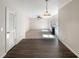 Open floor plan featuring living room with fireplace, hardwood floors, and ample natural light at 6260 Selborn Sw Dr, Atlanta, GA 30331