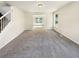 Cozy living room with plush carpet and a great view into the dining room at 6260 Selborn Sw Dr, Atlanta, GA 30331
