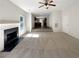 Cozy living room with fireplace and neutral carpet, seamlessly connected to the kitchen area at 6260 Selborn Sw Dr, Atlanta, GA 30331