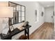 Inviting entryway with stylish console table and decor, leading to a bright, modern kitchen at 6427 Rosetta Dr # 64, South Fulton, GA 30331