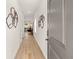 Bright hallway featuring hardwood floors and modern wall decorations leading into a living space at 6427 Rosetta Dr # 64, South Fulton, GA 30331