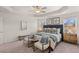 Serene primary bedroom with tray ceiling, neutral colors, and coordinated furniture creating a relaxing retreat at 6427 Rosetta Dr # 64, South Fulton, GA 30331