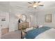 Bright primary bedroom with tray ceilings and neutral palette, features an ensuite bathroom at 6427 Rosetta Dr # 64, South Fulton, GA 30331