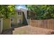 Fenced backyard featuring a sliding glass door and a view of the home's exterior at 6964 Oakhill Cir, Austell, GA 30168