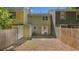 Enclosed backyard and townhome exteriors offer views of the outdoor area at 6964 Oakhill Cir, Austell, GA 30168