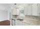 Remodeled kitchen featuring granite countertops and modern stainless steel appliances at 6964 Oakhill Cir, Austell, GA 30168