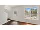 Bright living room with fresh white paint, large window and stylish flooring at 6964 Oakhill Cir, Austell, GA 30168