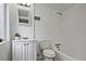 A clean bathroom features a standard bathtub-shower, toilet, and vanity with a decorative plant at 783 Lost Creek Cir, Stone Mountain, GA 30088