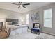 Cozy bedroom with neutral walls, soft carpet, and natural light from large windows at 783 Lost Creek Cir, Stone Mountain, GA 30088